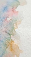 Soft watercolor paint blending on textured paper with pastel rainbow hues creating organic flowing patterns for artistic backgrounds and creative projects.