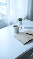 Minimalist workspace with white mug of coffee, open notebook, pen, and small succulent plant on clean desk by bright window with sheer curtains for office, productivity, and lifestyle content.