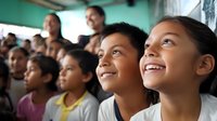 Diverse group of Hispanic children looking up with excitement and wonder during educational event or performance in classroom setting.