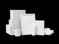 Blank white product mockup collection featuring stacked cardboard boxes, framed poster, cosmetic tubes, mug, and tissue box isolated on transparent background. Ready for branding, packaging design, t-shirt printing, sublimation, and print-on-demand projects.