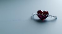 Red heart with heartbeat line pattern bound by silver chains on soft gray background, symbolizing love struggles, emotional bonds, and relationship challenges.