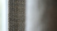 Natural woven fabric texture with rough burlap weave pattern in neutral beige tones for rustic interior design and craft projects.