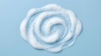 White foam cream swirl spiral pattern on light blue background for skincare cosmetic product design and beauty advertising.