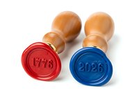 Pair of wax seals with wooden handles in red and blue, stamped with years 1776 and 2026, isolated on white background for design use.