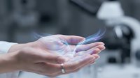 Hands holding iridescent soap bubble with blurred background, representing fragility, care, and delicate moments for editorial and lifestyle content.
