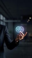 Businessman holding glowing digital film reel hologram in modern office environment representing cinema technology and entertainment industry innovation.