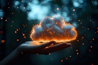 Magical glowing cloud floating above open palm with sparkles and bokeh lights against dark background, creating mystical atmosphere for fantasy designs.