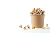 Fresh popcorn overflowing from beige paper cup on white background, scattered kernels create minimalist composition for food and entertainment concepts.