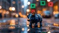 Miniature blue bull figurine on wet city street with bokeh lights and reflections creating magical urban atmosphere. Financial market concept.