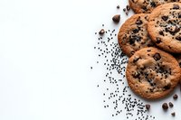 Fresh baked chocolate chip cookies scattered with dark chocolate drops and black sesame seeds on white background, minimalist food composition.