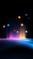 Glowing abstract background with colorful light rays and floating orbs creating magical atmosphere against dark backdrop. Futuristic horizon with pink and blue illumination.