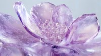 Delicate purple crystal flower with translucent petals and intricate center detail glows with ethereal light against dark background, creating magical artistic effect.