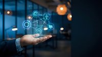 Businessman hand holding glowing digital icons representing renewable energy, wind power, solar panels, and sustainable technology solutions for green business innovation.
