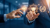 Businessman in suit touching glowing lightbulb icon with handshake and laurel wreath symbols representing innovation, partnership, and success in corporate environment.