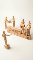 Wooden figurines collaborating around stacked blocks spelling together, representing teamwork, unity, and cooperation for business and corporate concepts.