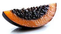 Fresh papaya slice with black seeds showing vibrant orange flesh against white background, highlighting tropical fruit texture for food photography.