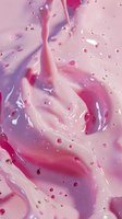 Abstract pink and purple liquid swirls with water drops creating dynamic flowing pattern. Macro photography of cosmetic cream or paint mixture for beauty industry.