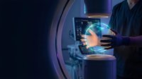 Technician in dark uniform examining glowing holographic sphere with blue light in futuristic laboratory setting, advanced technology and innovation concept.
