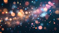 Magical glowing particles and bokeh lights scattered on dark background create dreamy atmosphere with orange and blue sparkles floating in space.