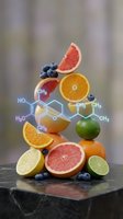 Fresh citrus fruits with molecular structure overlay showing vitamin C and antioxidant compounds for nutrition science and healthy eating concepts.