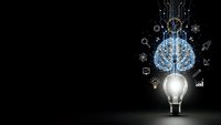 Glowing light bulb with digital brain and innovation icons on dark background representing artificial intelligence, creativity and technological breakthrough.