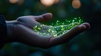 Magical glowing green particles floating above open palm at dusk, creating ethereal light effect against dark background.