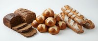 Assorted fresh baked bread loaves and rolls isolated on white background, ready for bakery, food service, or culinary design projects.