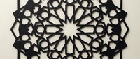 Intricate Islamic geometric star pattern with layered cutout design creating dimensional shadows on neutral background for decorative projects.