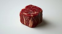 Raw beef tenderloin steak with marbling pattern on white background, fresh premium cut meat for restaurant menu and food photography.