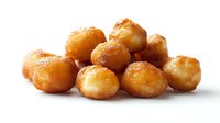 Golden fried dough balls piled together on white background, showcasing crispy exterior and soft interior for food menu or recipe blog.