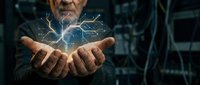 Senior Caucasian businessman holding glowing digital network connections in cupped hands representing technology innovation and data management solutions.