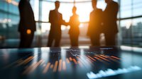 Silhouettes of business professionals analyzing financial data with stock market graph in foreground, dramatic sunset lighting through office windows creates atmosphere.