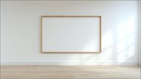 Empty wooden frame hanging on white wall in minimalist interior room with natural light and wooden floor for mockup design projects.