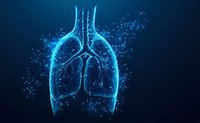 Glowing blue digital lungs with particle effects on dark background, medical technology concept visualization for healthcare and respiratory system studies.
