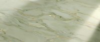 Elegant white marble surface with gold veining and natural stone texture for luxury interior design and architectural applications.