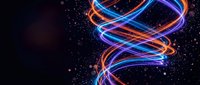 Vibrant neon light trails creating dynamic spiral patterns against dark starry background. Glowing blue orange purple energy streams for digital art projects.