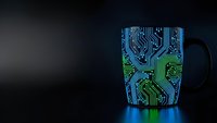 Technology coffee mug with glowing circuit board pattern on dark background for tech enthusiast morning routine and digital lifestyle concepts.