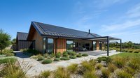 Modern sustainable home with solar panels and natural wood siding surrounded by drought-resistant landscaping under blue sky for eco-friendly living.