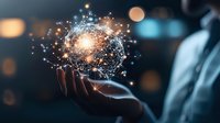 Glowing digital network sphere floating above business person's hand against dark background with bokeh lights, representing global connectivity.