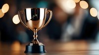Golden trophy cup on dark background with bokeh lights, symbolizing achievement and victory in competition or sports event.