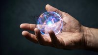 Hands holding glowing energy sphere with electric lightning effects for futuristic technology and power concepts.