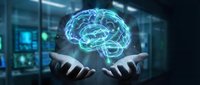 Digital brain hologram floating above businessman hands in modern office representing artificial intelligence and neural networks in corporate technology.