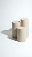 Three beige cylindrical pedestals of varying heights arranged on white background with soft shadows for product display and presentation purposes.