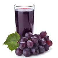 Fresh grape juice in glass with ripe purple grapes and green leaf on white background, natural beverage for healthy lifestyle and nutrition.