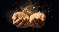 Open cupped hands releasing golden magical dust particles and sparkling lights against dark background for fantasy and spiritual concepts.