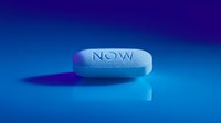 Blue pharmaceutical pill with NOW text on gradient background for medical and healthcare concepts.
