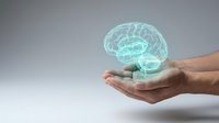 Hands holding glowing turquoise brain hologram representing mental health, neuroscience, artificial intelligence and cognitive psychology concepts.
