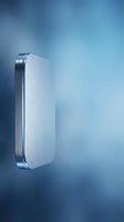 Modern silver metallic smartphone floating on blue gradient background with soft lighting and minimalist design for technology presentations.