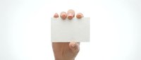Hand holding blank white business card mockup against clean background for branding and corporate identity design projects.