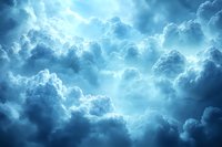 Dramatic blue storm clouds with sunlight breaking through creating ethereal atmosphere. Moody sky background for weather, spiritual, and environmental themes.